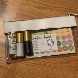 Essential Oil Pouch with Abundance Blend, 2 5mL rollerballs & oil stickers (w)